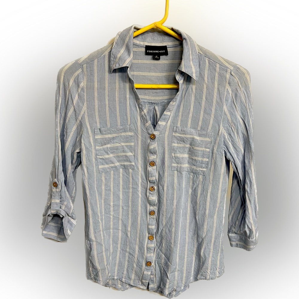 Light blue and white women’s button down shirt.
